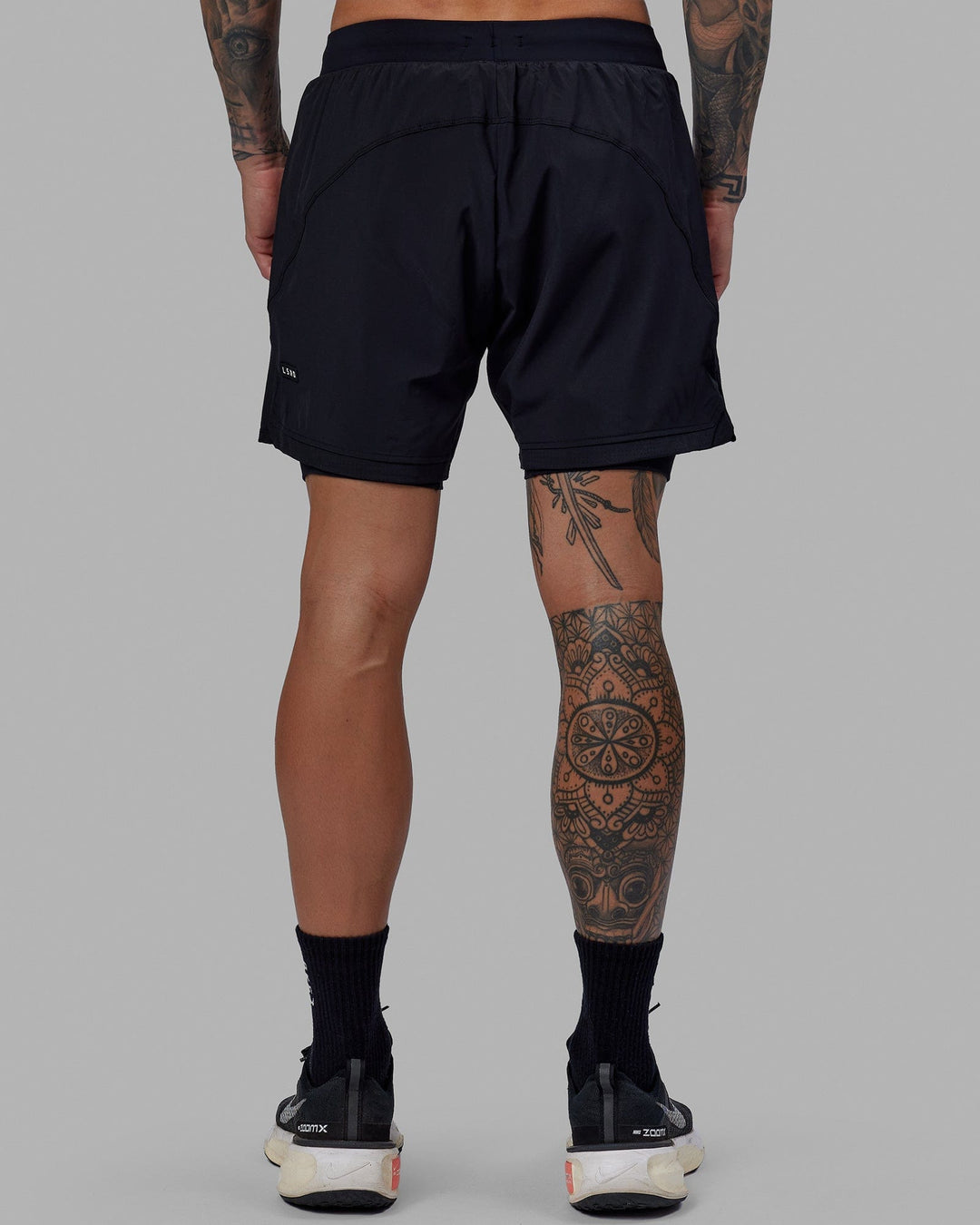 Man wearing Challenger 6&quot; Lined Performance Short - Black