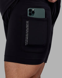 Man wearing Challenger 6" Lined Performance Short - Black