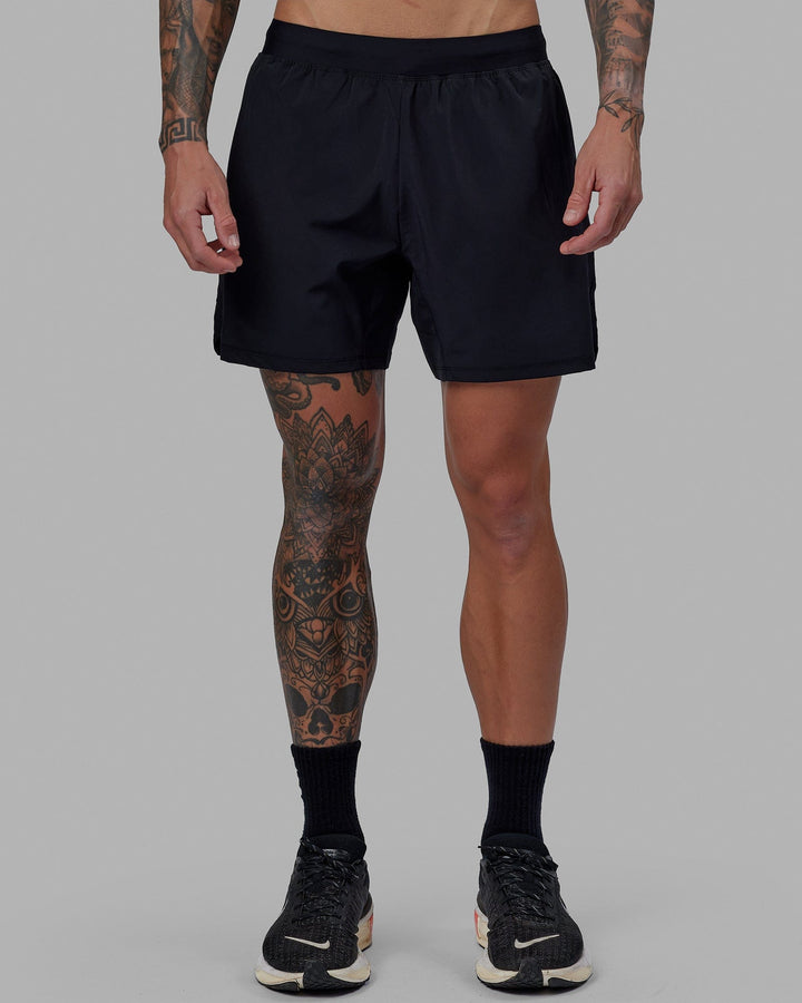 Man wearing Challenger 6" Performance Short - Black