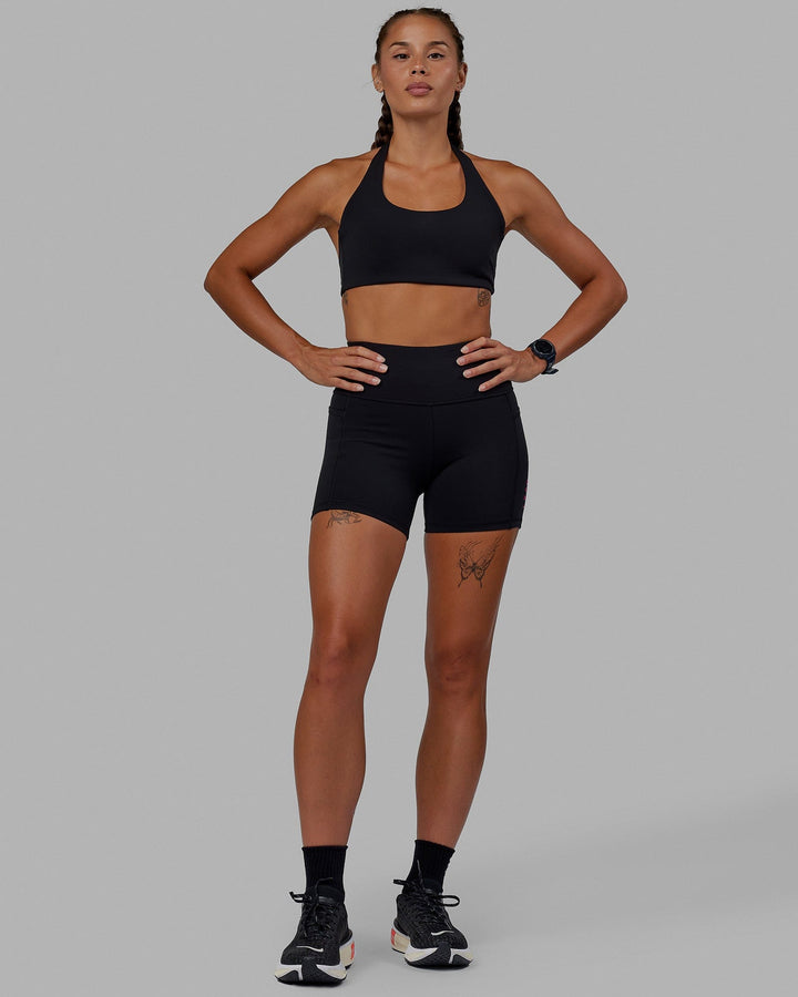 Woman wearing Challenger Sports Bra - Black