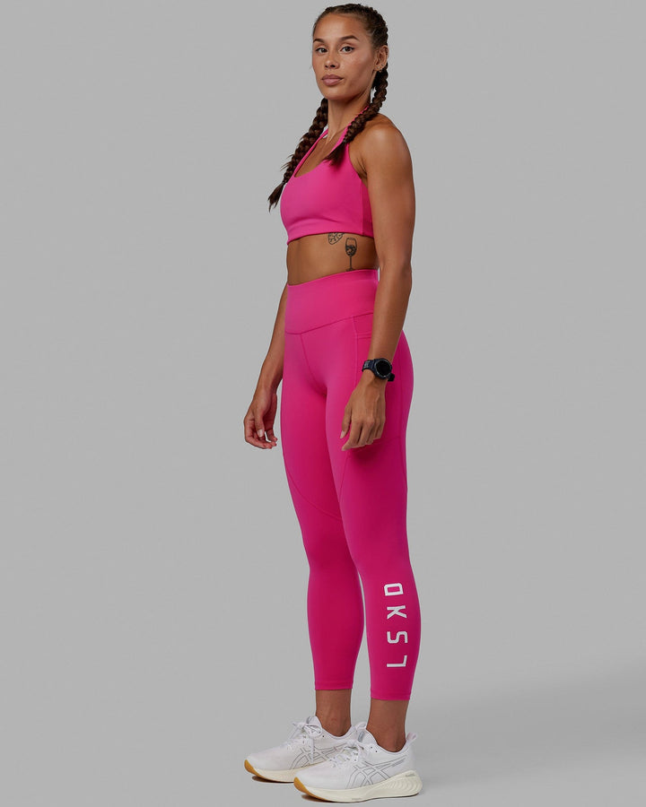 Woman wearing Challenger Sports Bra - Ultra Pink