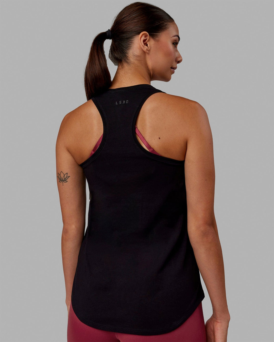 Woman wearing Charge PimaFLX-Lite Active Tank - Black