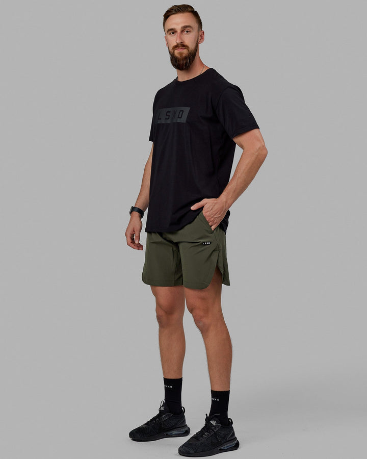 Man wearing Competition 8" Performance Short - Forest Night
