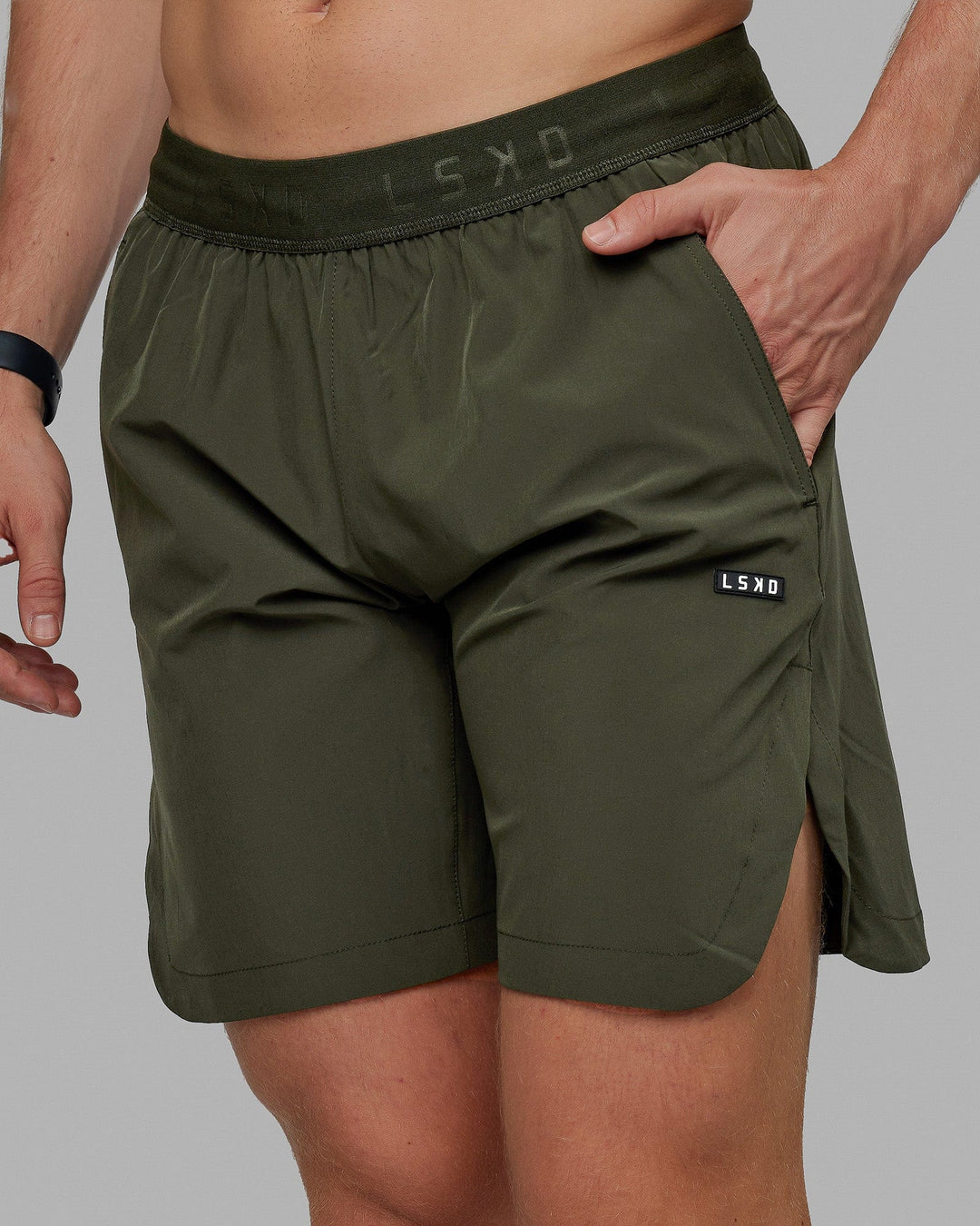 Man wearing Competition 8" Performance Short - Forest Night
