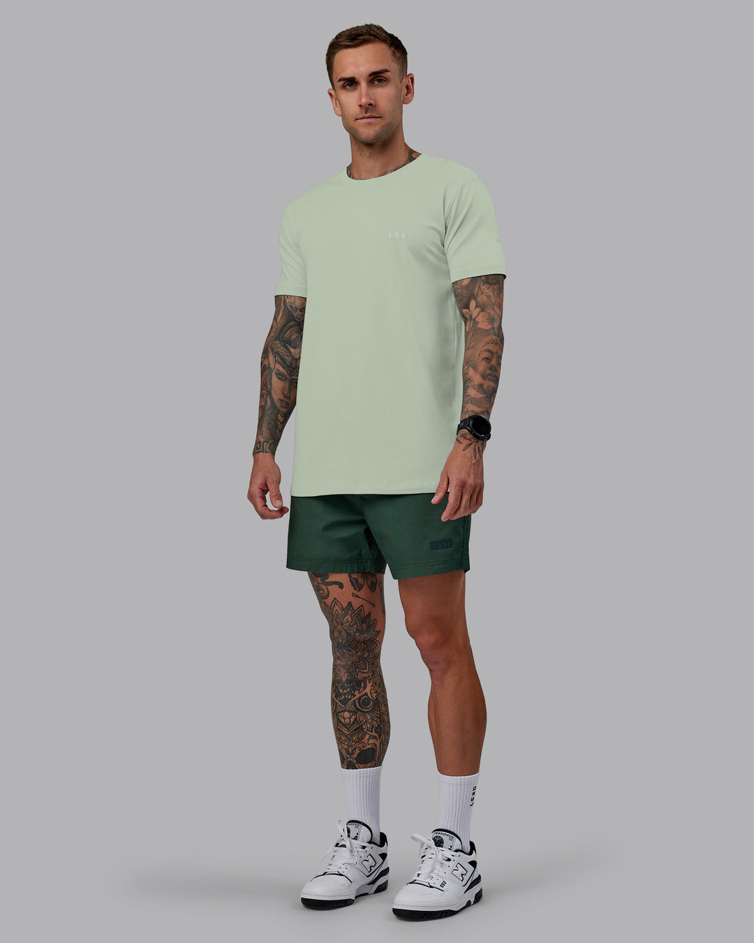 Man wearing Daily 5" Shorts - Cilantro