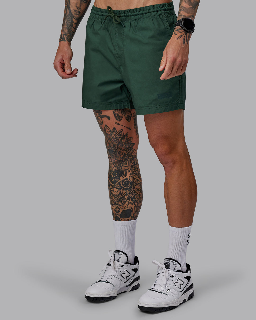 Man wearing Daily 5" Shorts - Cilantro
