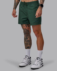 Man wearing Daily 5" Shorts - Cilantro