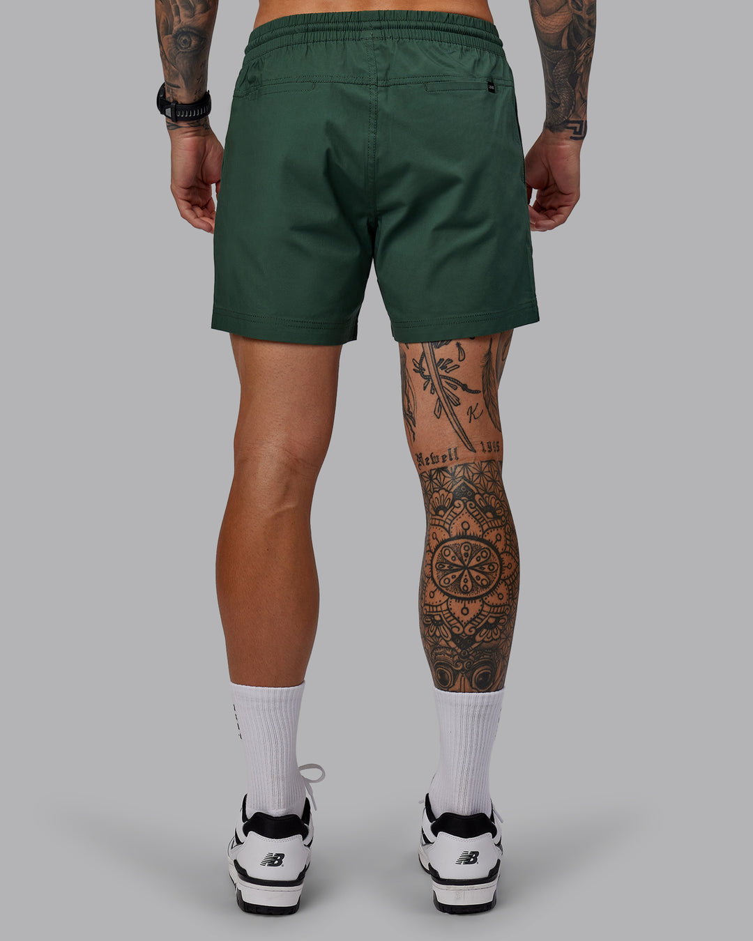 Man wearing Daily 5" Shorts - Cilantro