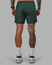 Man wearing Daily 5" Shorts - Cilantro