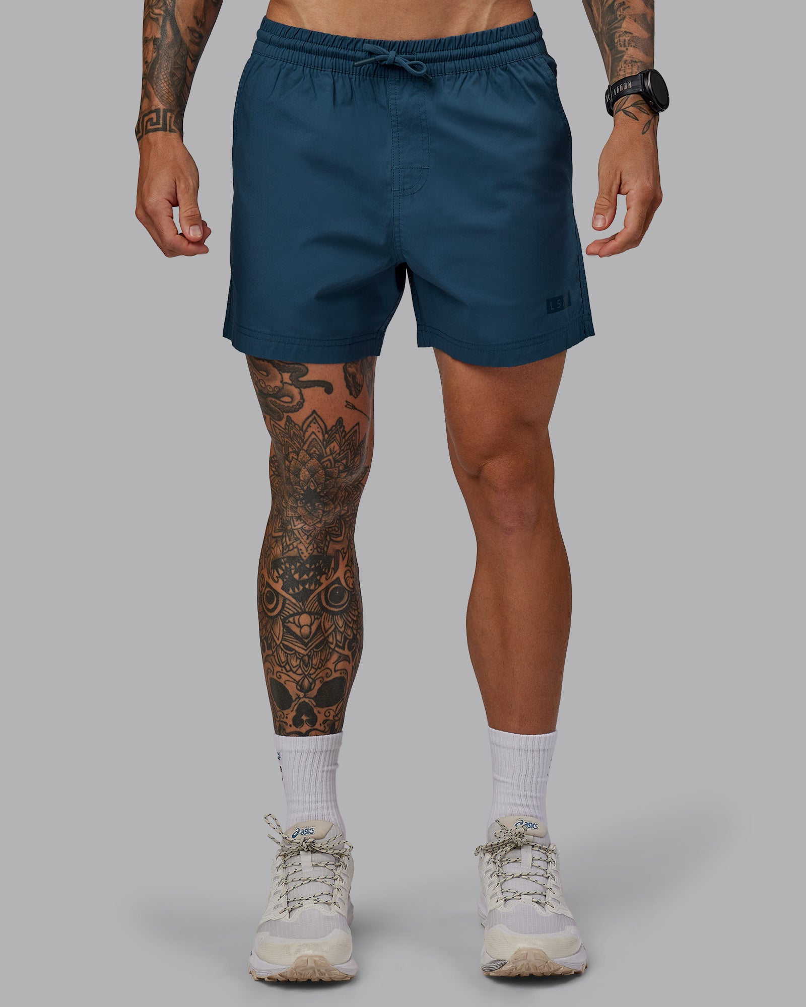 Man wearing Daily 5" Shorts - Indigo