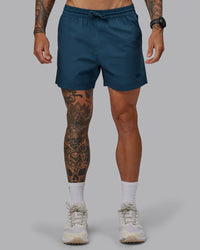 Man wearing Daily 5" Shorts - Indigo