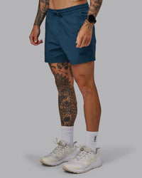 Man wearing Daily 5" Shorts - Indigo
