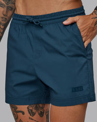 Man wearing Daily 5" Shorts - Indigo