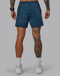 Man wearing Daily 5" Shorts - Indigo