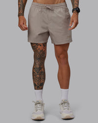 Man wearing Daily 5" Shorts - Shale Beige