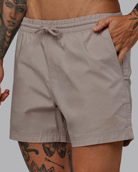 Man wearing Daily 5" Shorts - Shale Beige