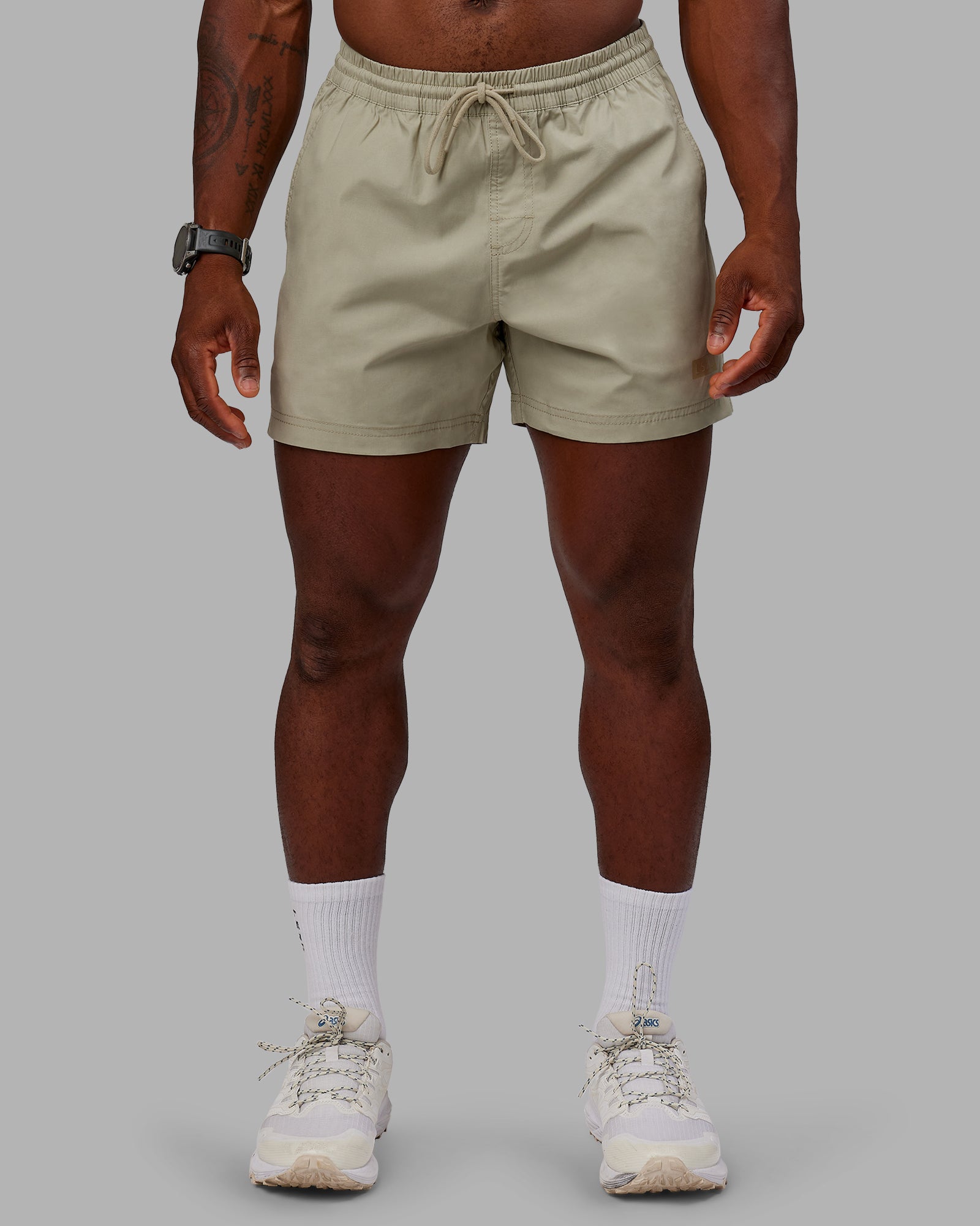 Man wearing Daily 5" Shorts - Sustained Grey