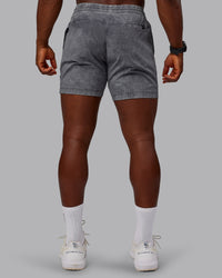 Man wearing Washed Daily 5" Shorts - Circular Grey