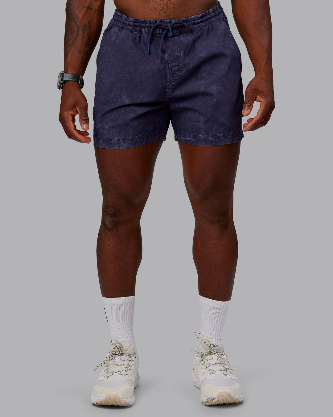 Man wearing Washed Daily 5" Shorts - Midnight Blue