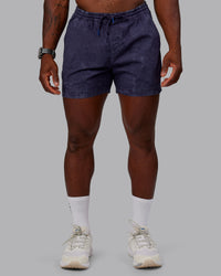 Man wearing Washed Daily 5" Shorts - Midnight Blue