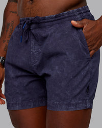 Man wearing Washed Daily 5" Shorts - Midnight Blue