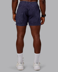 Man wearing Washed Daily 5" Shorts - Midnight Blue