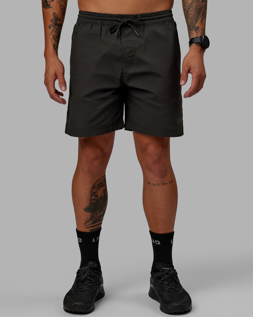 Man wearing 7&quot; Daily Shorts - Pirate Black | Model:Jemile | Size:M