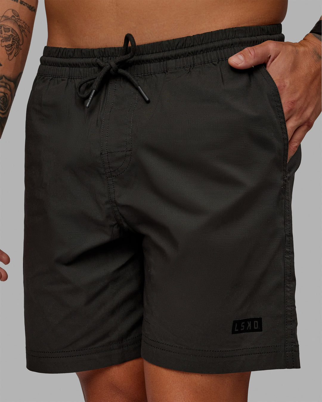 Man wearing 7&quot; Daily Shorts - Pirate Black | Model:Jemile | Size:M