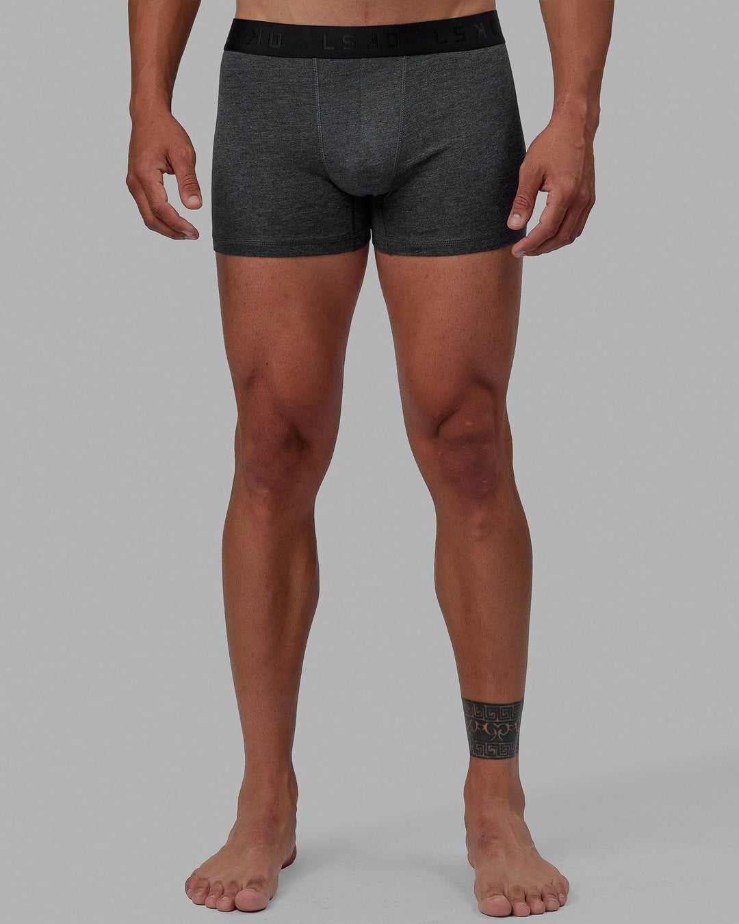 Man wearing daily trunks - dark grey.