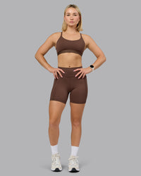 Woman wearing Define Sports Bra - Chocolate Martini | Model:Halle | Size:S