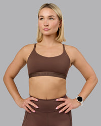 Woman wearing Define Sports Bra - Chocolate Martini | Model:Halle | Size:S