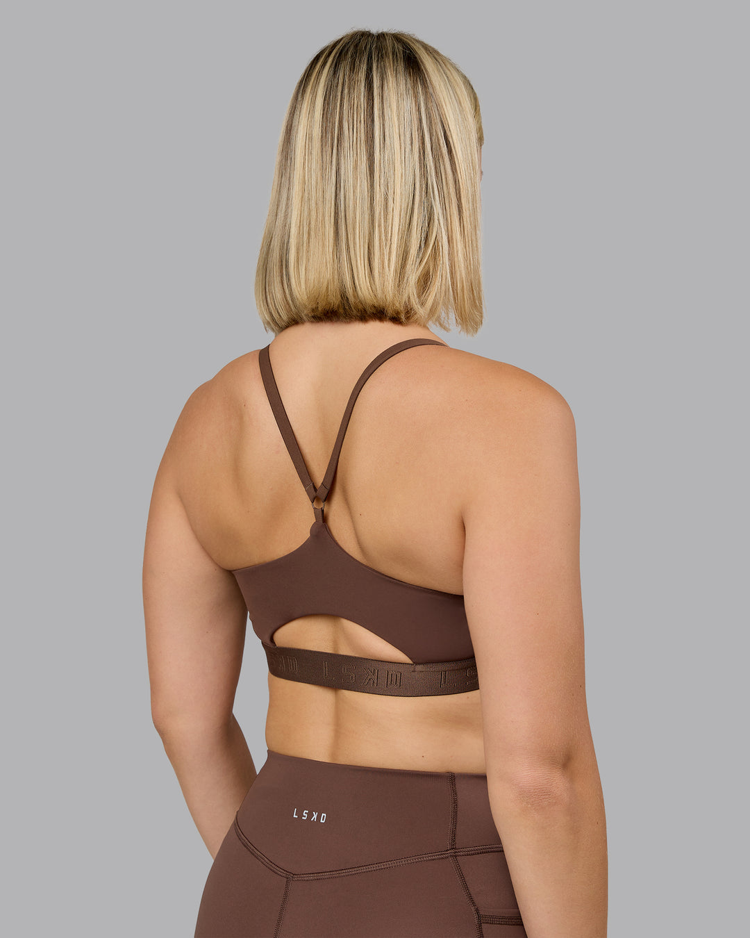 Woman wearing Define Sports Bra - Chocolate Martini | Model:Halle | Size:S