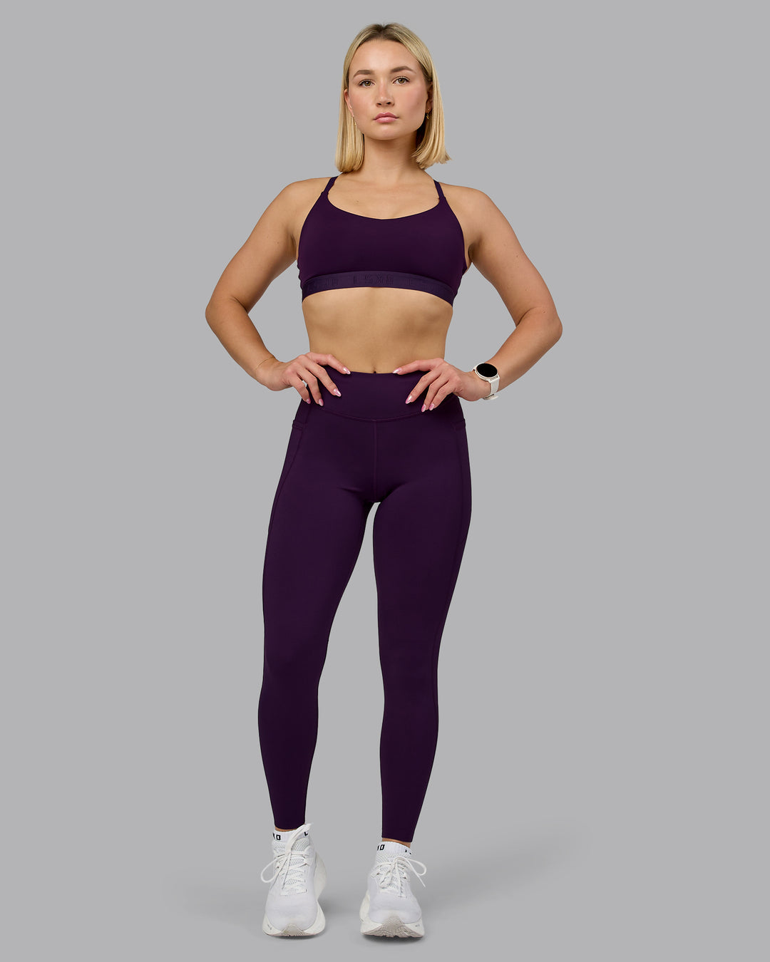 Woman wearing Define Sports Bra - Deep Purple | Model:Halle | Size:S