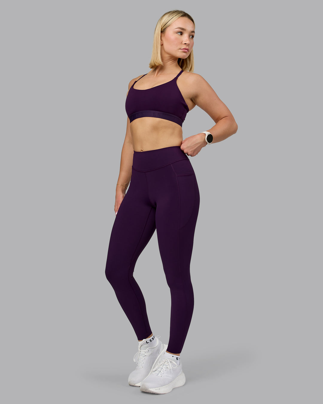 Woman wearing Define Sports Bra - Deep Purple | Model:Halle | Size:S