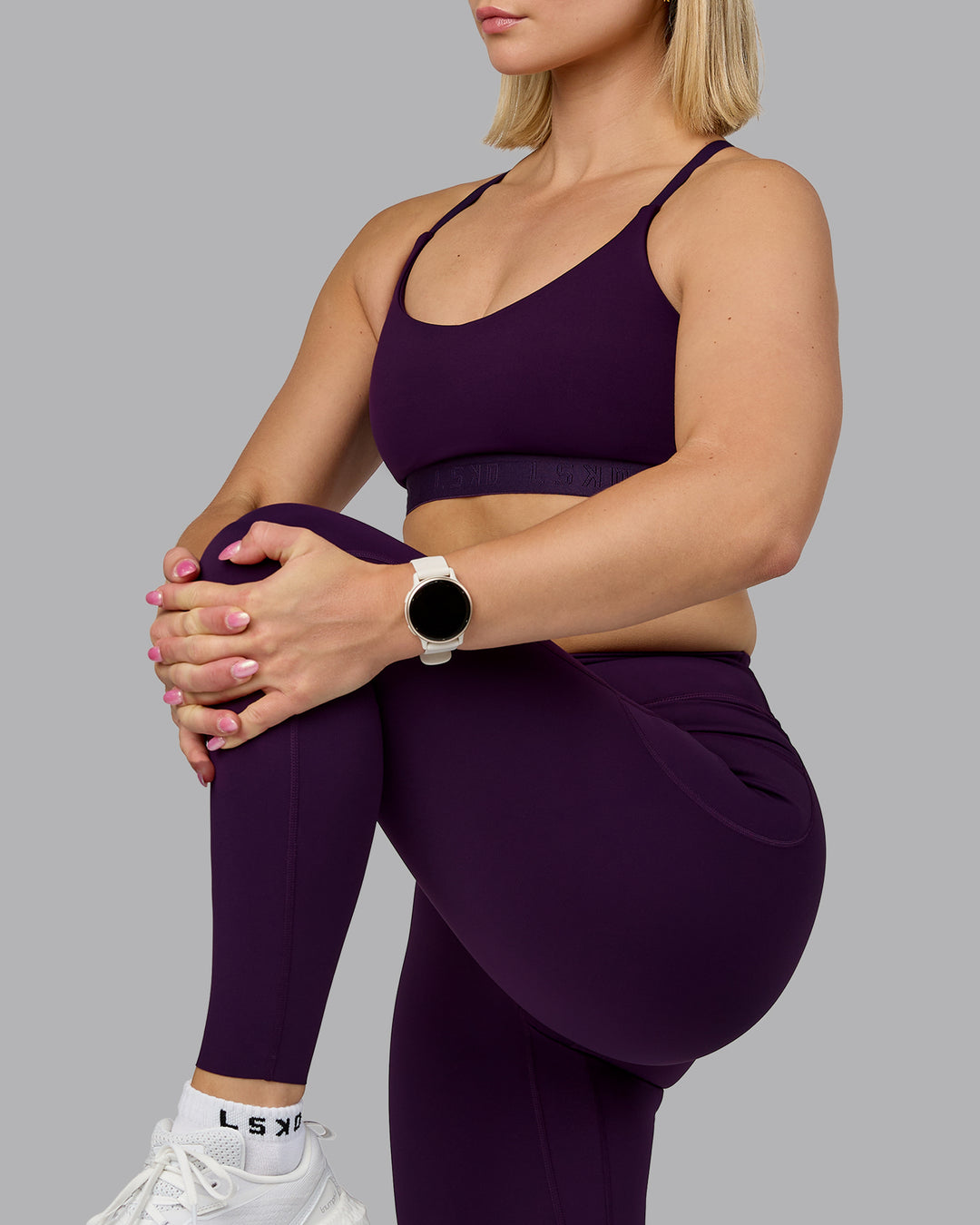 Woman wearing Define Sports Bra - Deep Purple | Model:Halle | Size:S