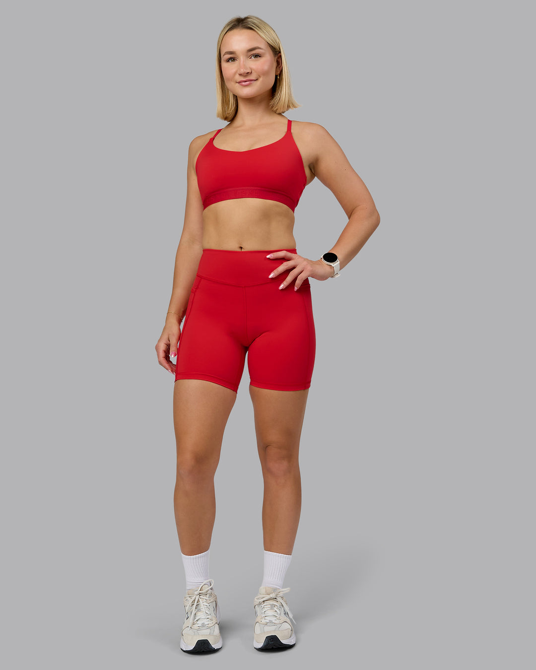 Woman wearing Define Sports Bra - Flame | Model:Halle | Size:S