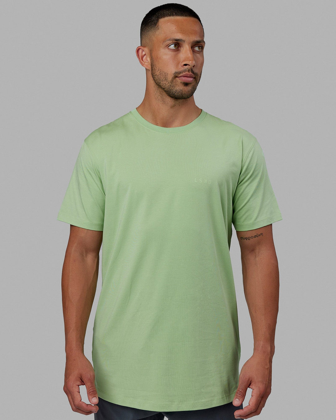 Man wearing Deluxe PimaFLX Tee - Green Fig