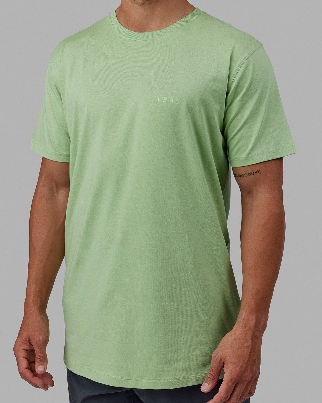 Man wearing Deluxe PimaFLX Tee - Green Fig