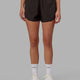 Woman wearing Dynamic Run Short - Dark Walnut