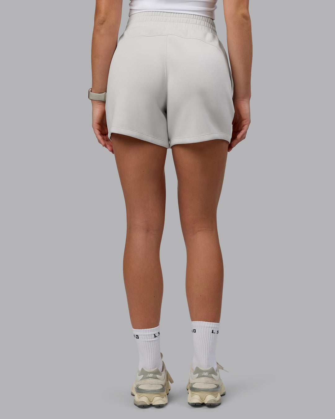 Woman wearing Elevate SoftTouch 4&quot; Shorts - Clay-Clay