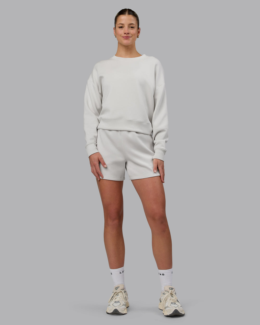 Woman wearing Elevate SoftTouch 4&quot; Shorts - Clay-Clay