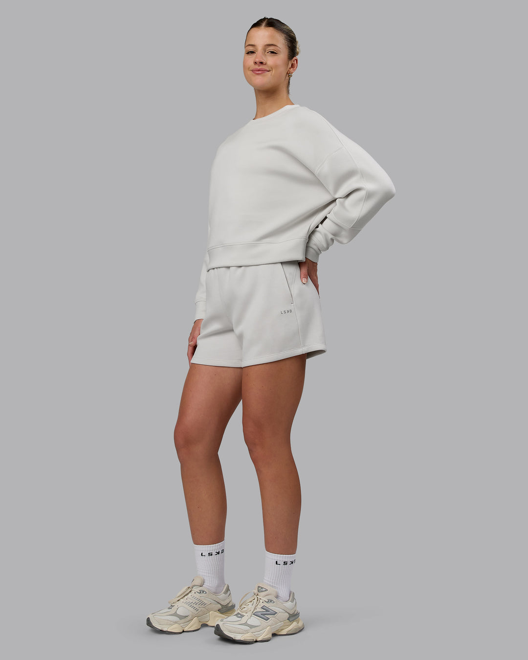 Woman wearing Elevate SoftTouch 4&quot; Shorts - Clay-Clay