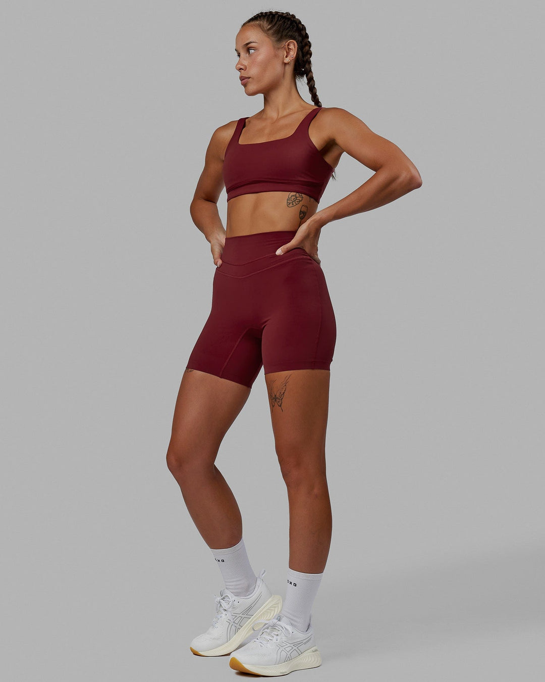 Woman wearing Elevation Sports Bra - Cranberry