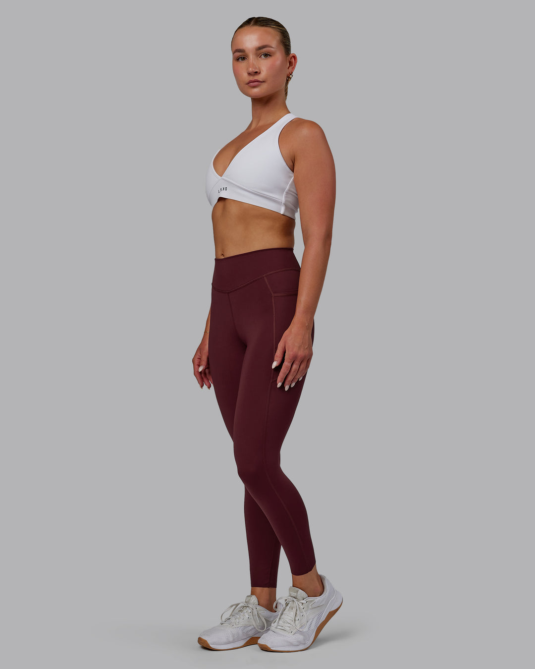 Woman wearing Elite High-Rise 7/8 Legging Pockets - Dark Cherry