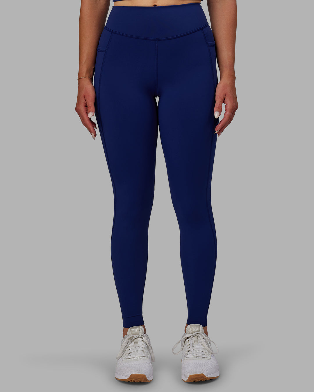 Woman wearing Elite High-Rise Full Length Legging Pockets - Midnight Blue
