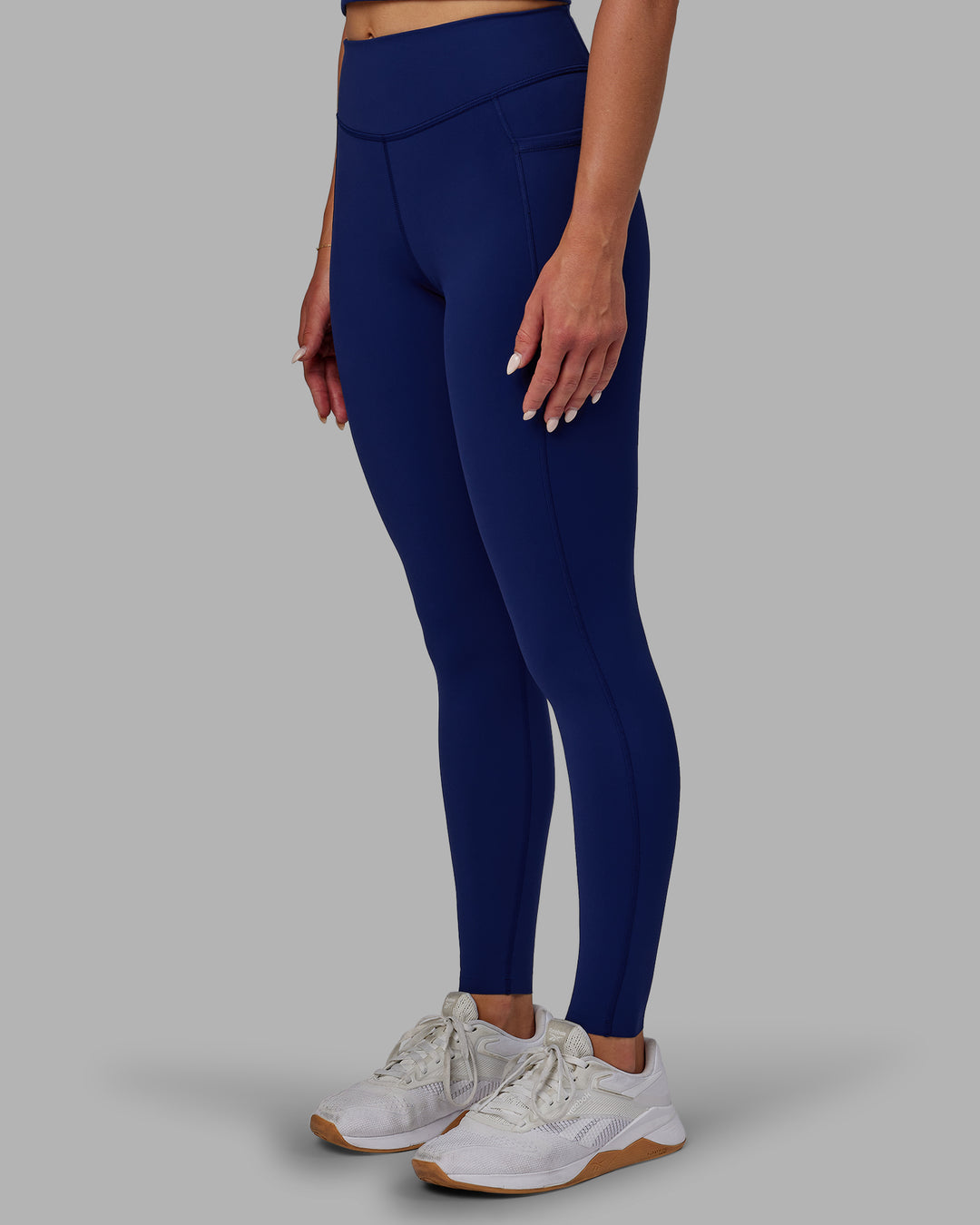 Woman wearing Elite High-Rise Full Length Legging Pockets - Midnight Blue