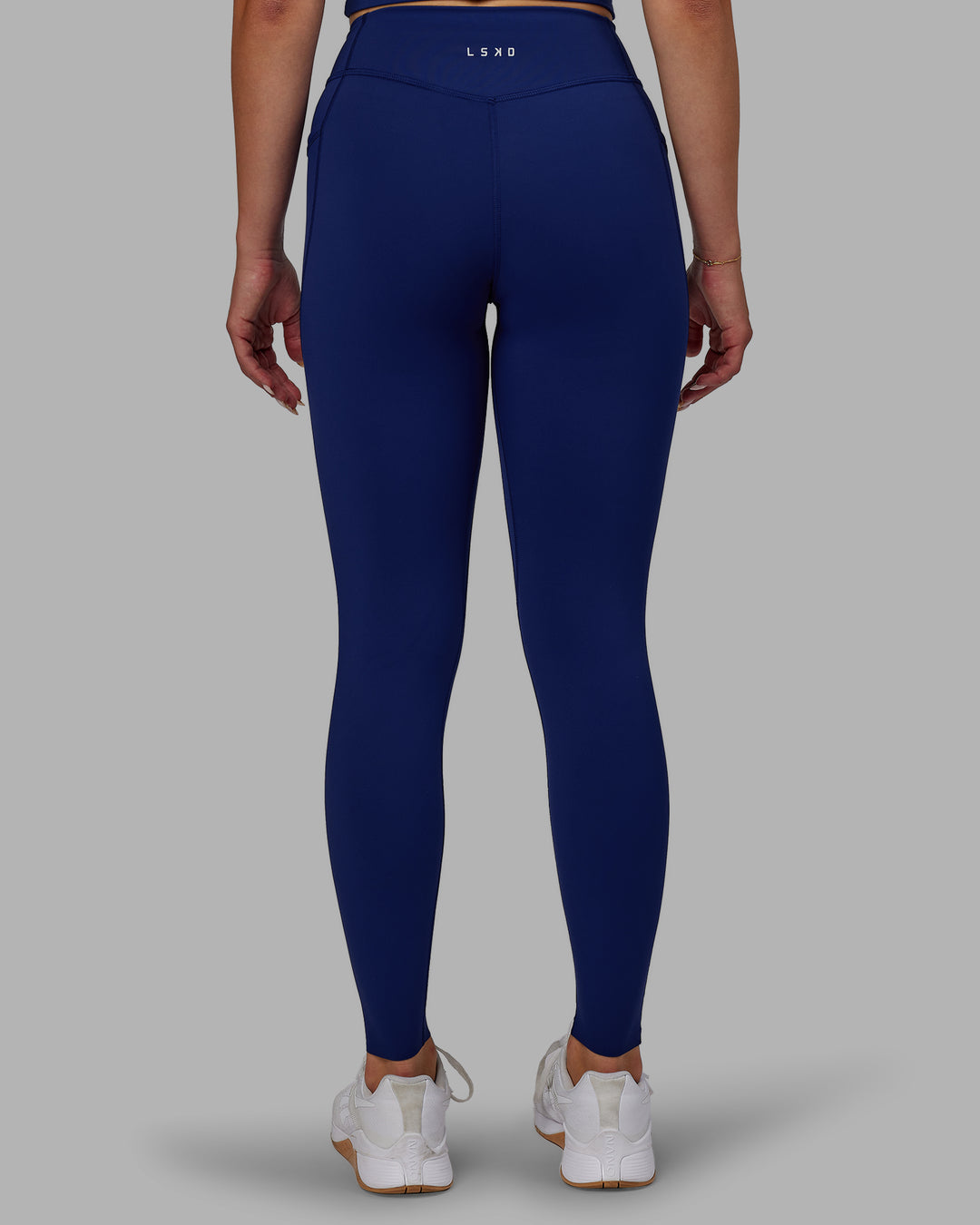 Woman wearing Elite High-Rise Full Length Legging Pockets - Midnight Blue