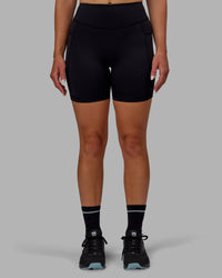 Woman wearing Elite High-Rise 6" Short Pockets - Black