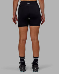 Woman wearing Elite High-Rise 6" Short Pockets - Black