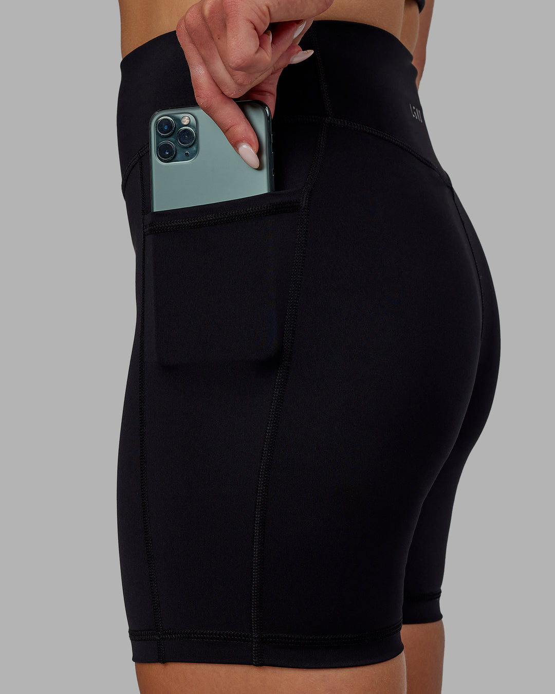Woman wearing Elite High-Rise 6" Short Pockets - Black